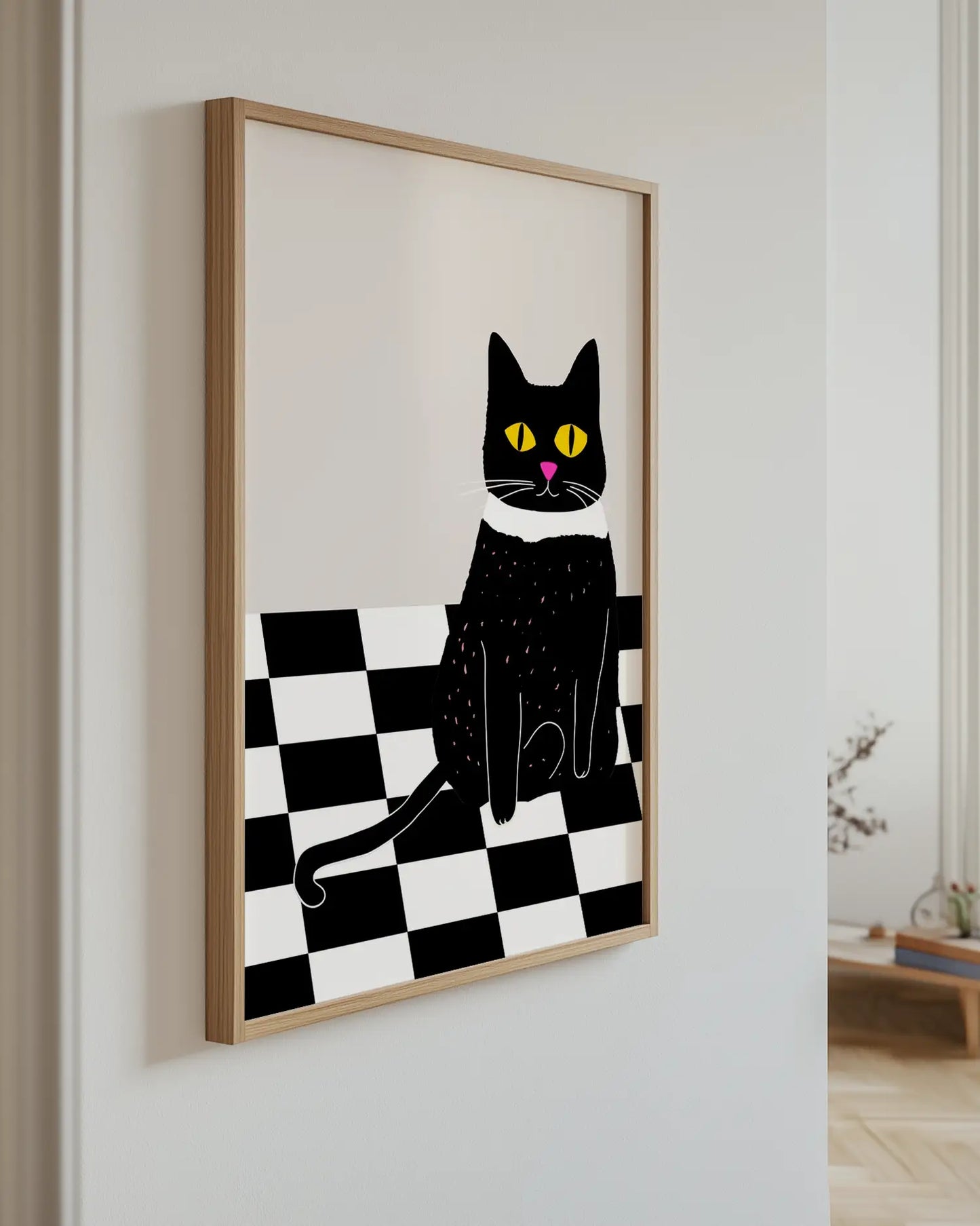 Artwork of a black cat on a checkered background in a room.