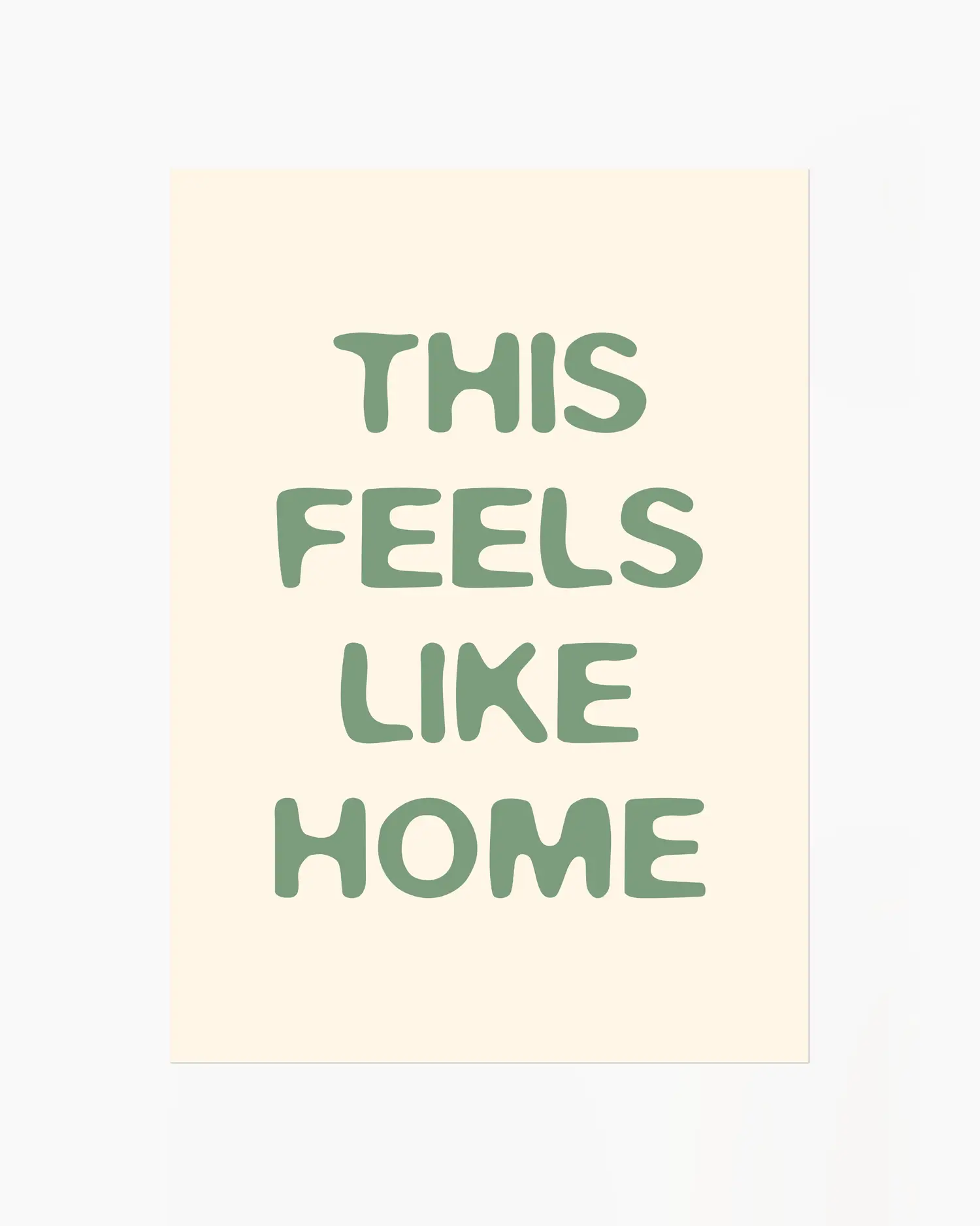Nursery poster with the text 'This feels like home' written in green