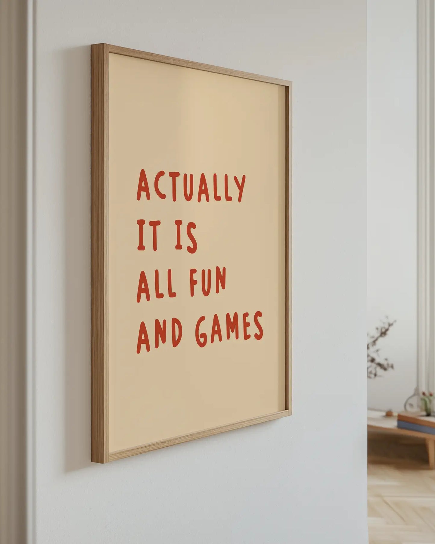 Artwork with motivational quote 'Actually it is all fun and games' on a wall.