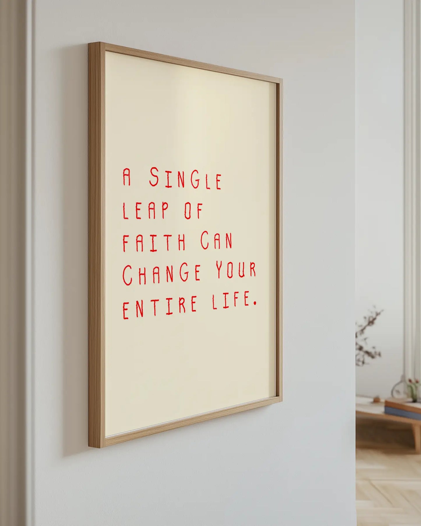 Framed motivational quote on a wall with a neutral background