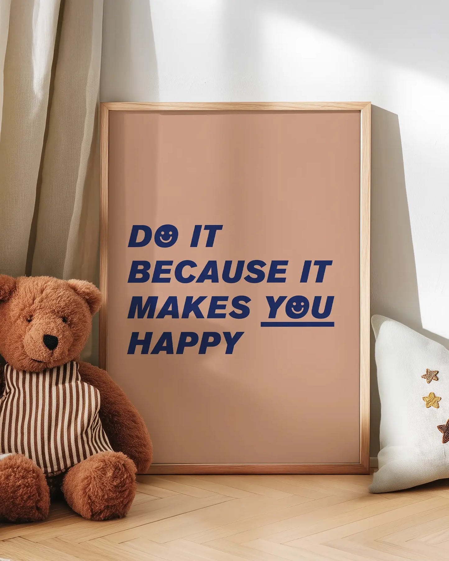 Interior design – wallart poster with quote with teddy bear and decorative pillow on a wooden floor.