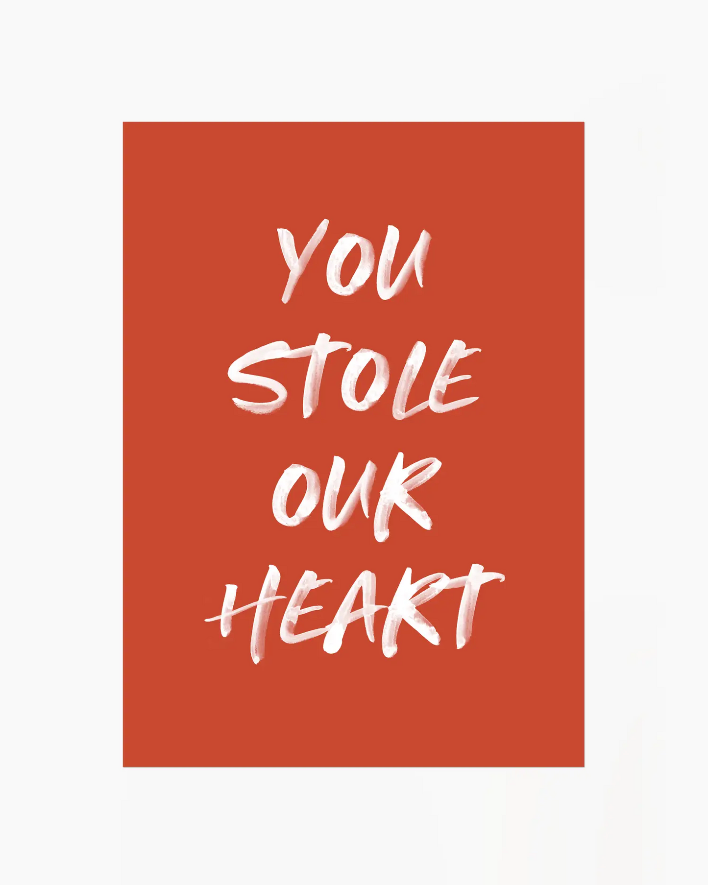 Nursery poster with white text 'You stole our heart' on a red background.