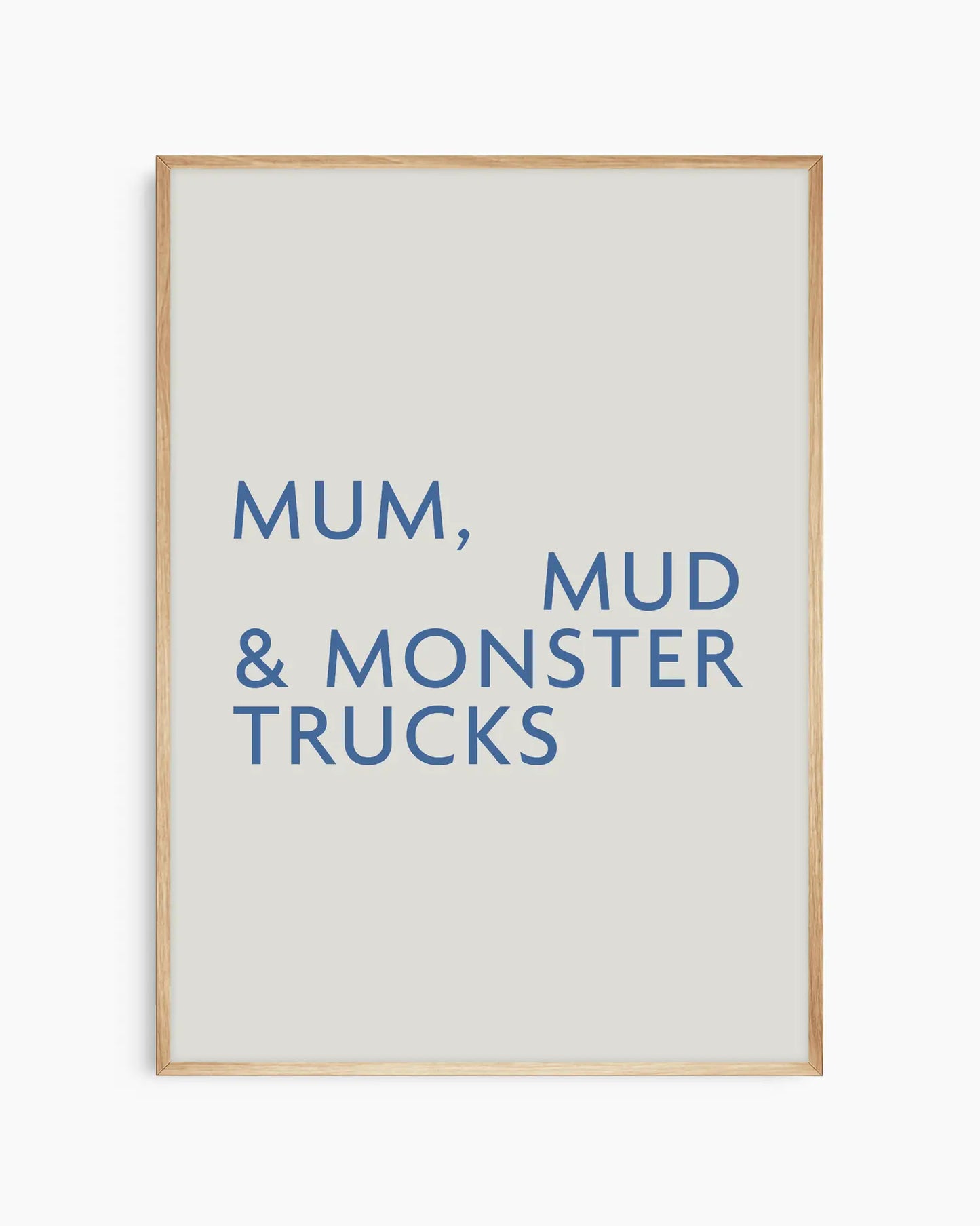 Poster with text 'Mum, Mud & Monster Trucks' in an oak frame.