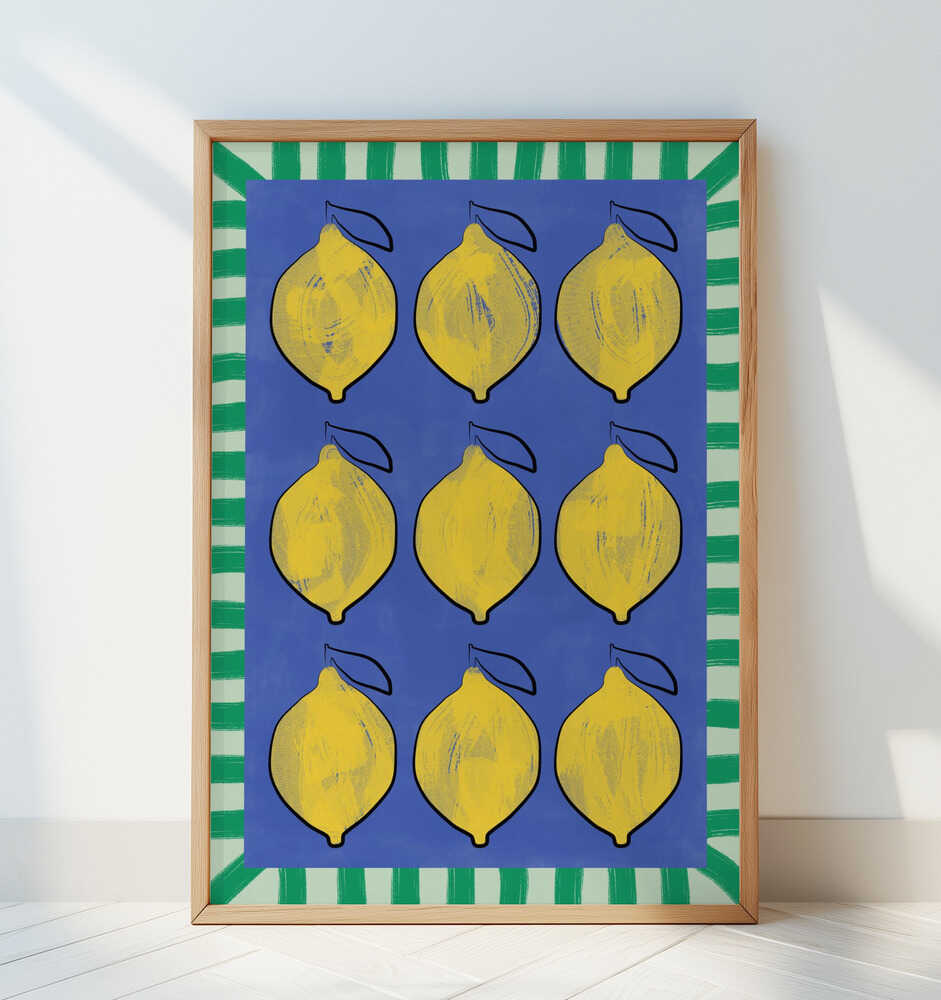 Framed poster of lemons on a blue background and a green striped frame around it