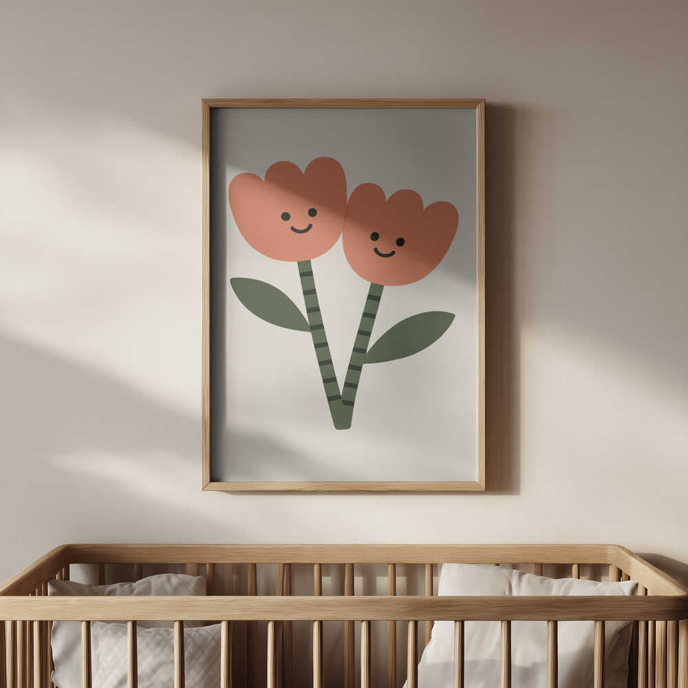 Framed poster with two happy flowers hanging on the wall in the nursery above the baby crib.
