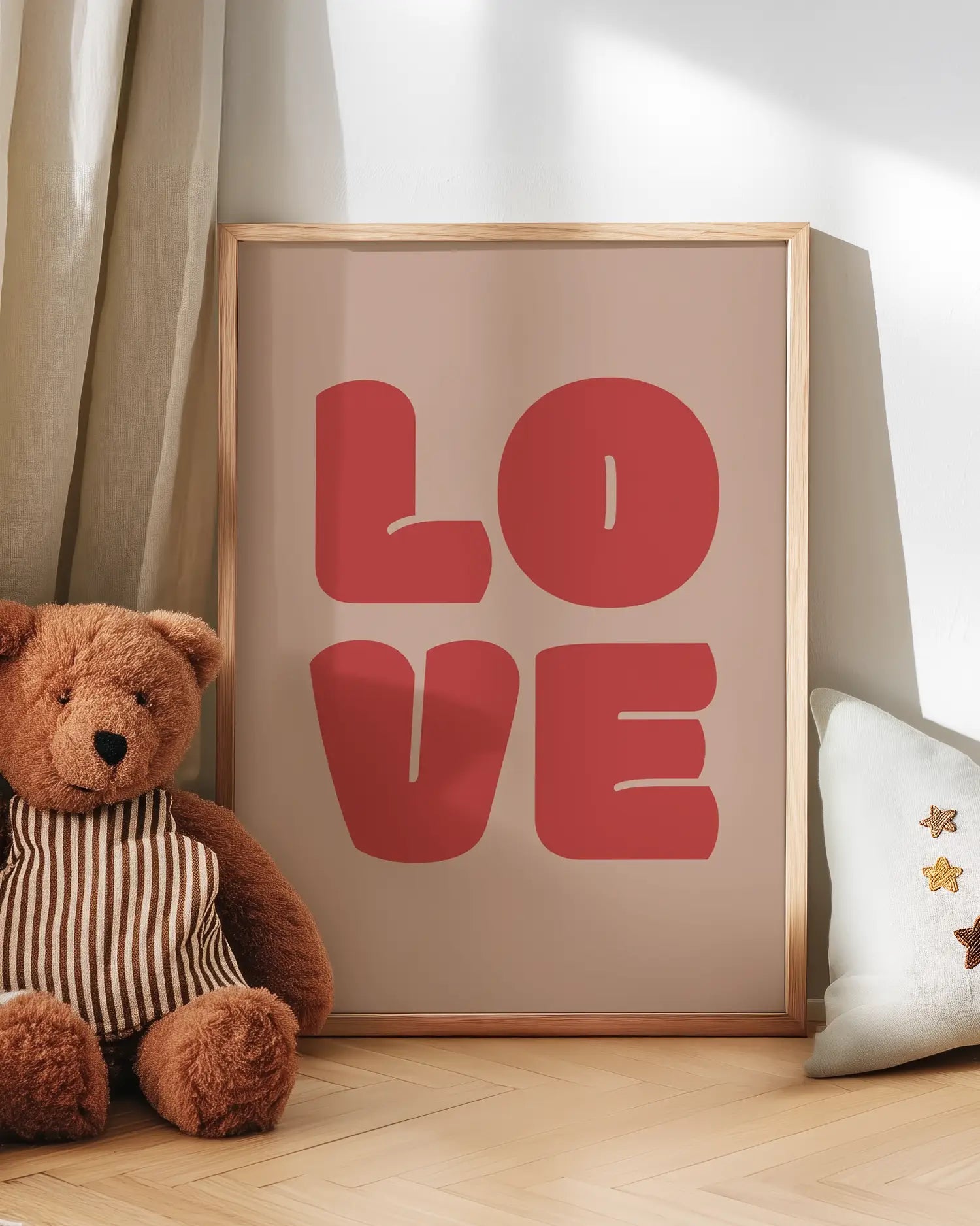 Artwork with 'LOVE' in bold red letters next to a teddy bear on a wooden floor.
