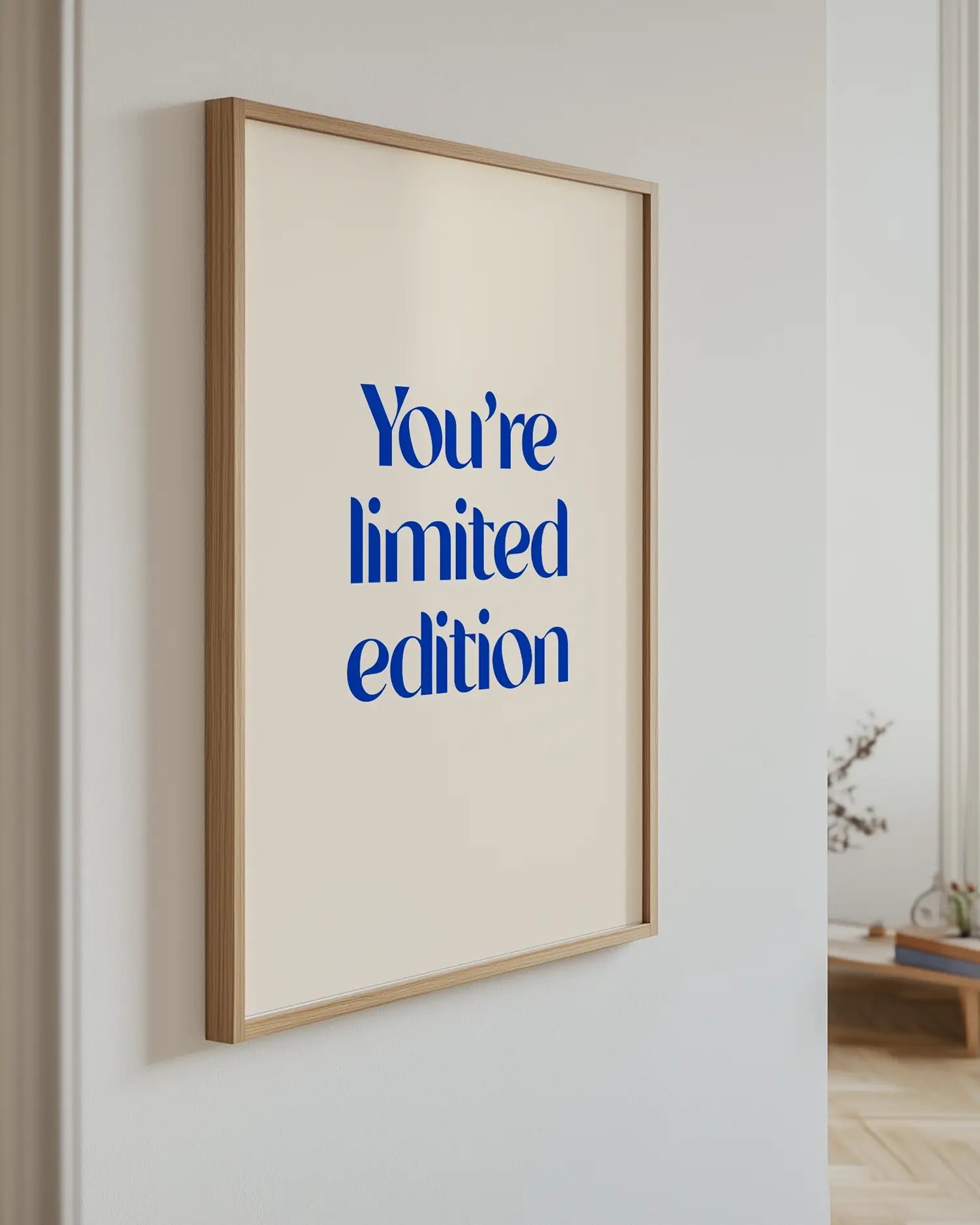 Artwork with 'You're limited edition' text on a wall.