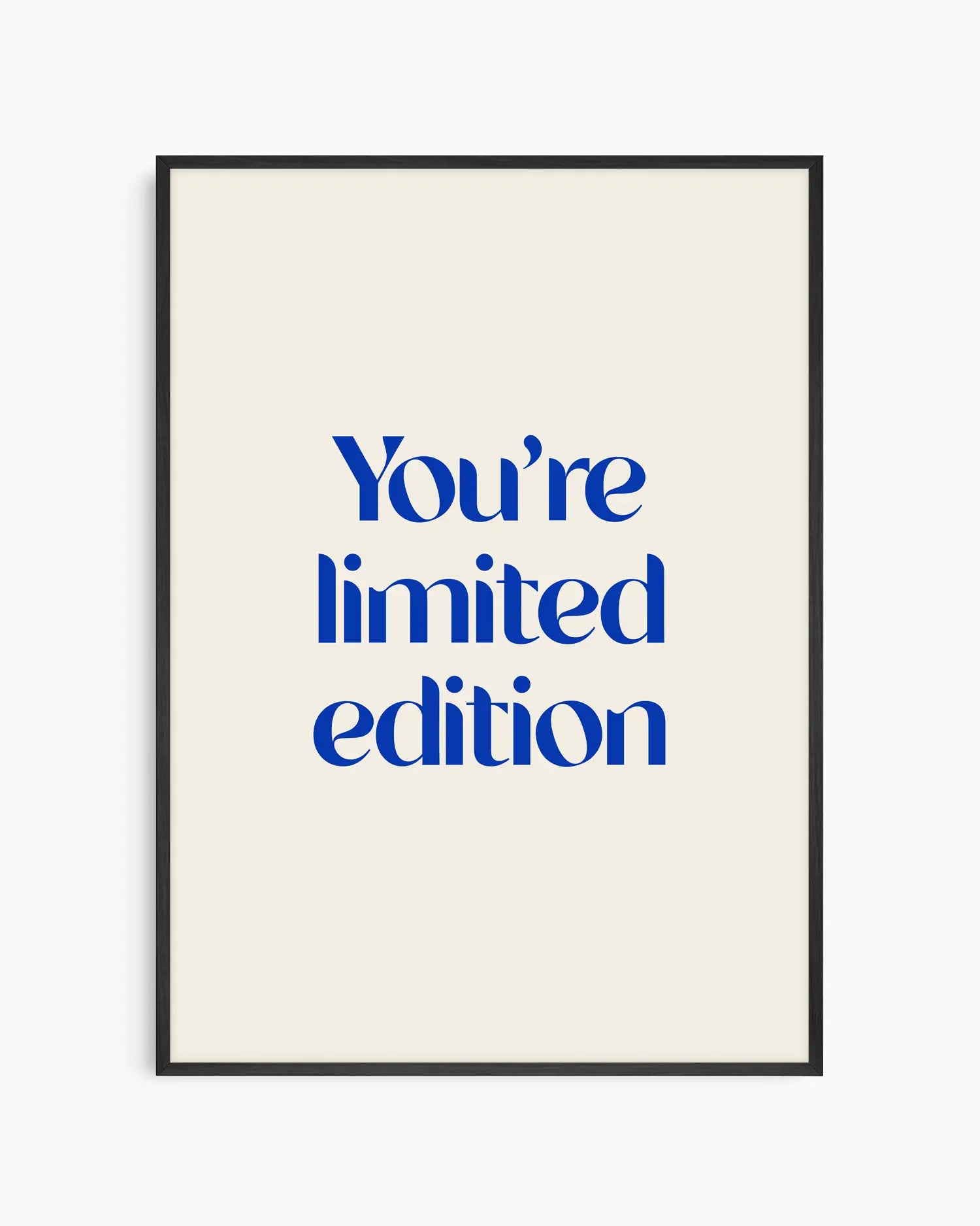 Nursery poster with 'You're limited edition' text in blue framed in a black wooden frame