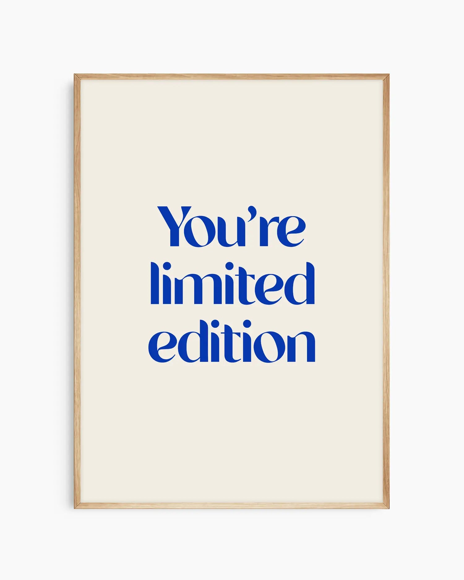 Nursery poster with 'You're limited edition' text in blue framed in an oak frame