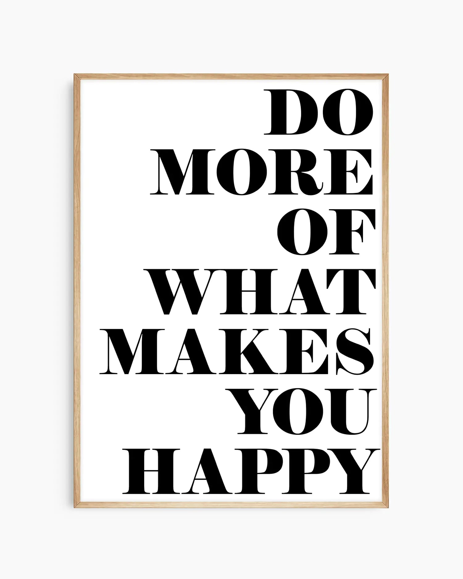Motivational nursery poster with the text 'Do more of what makes you happy' written on a white background framed in an oak frame