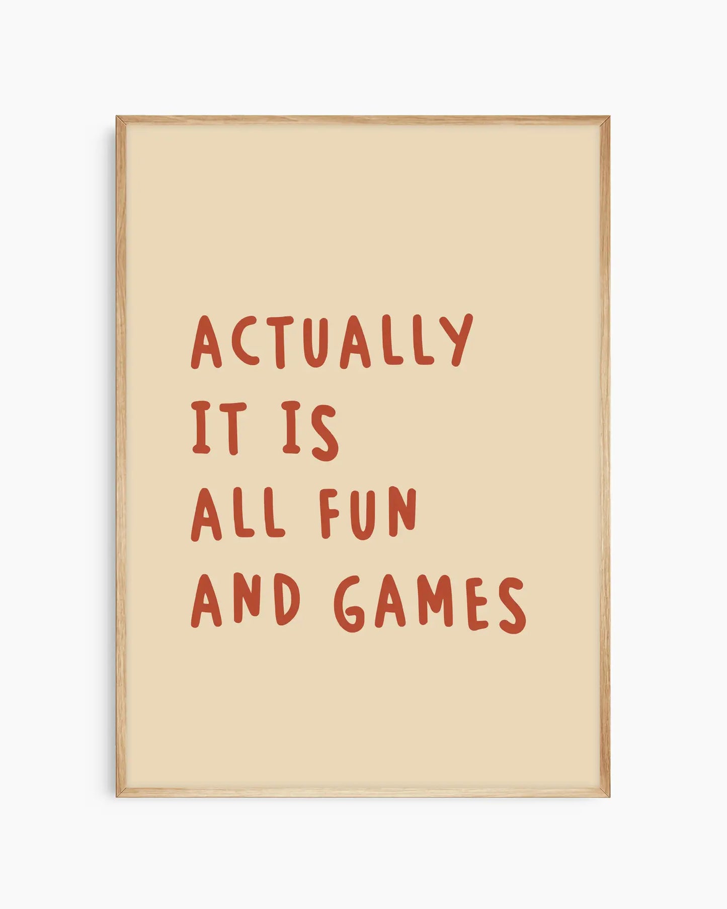 Beige nursery poster with the text 'Actually it is all fun and games'  framed in an oak frame