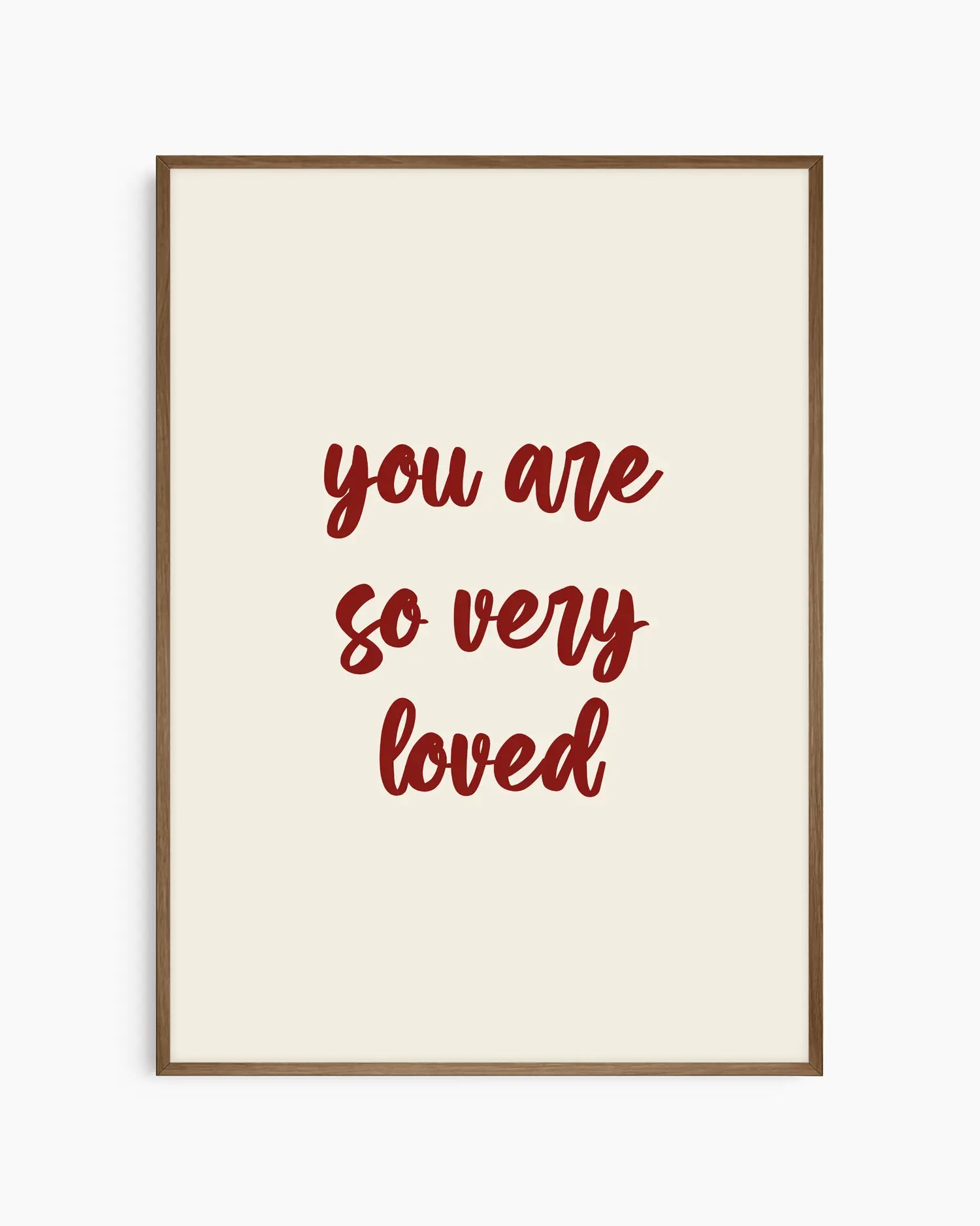 Nursery poster with red 'you are so very loved' text on a beige background. Dark oak frame.
