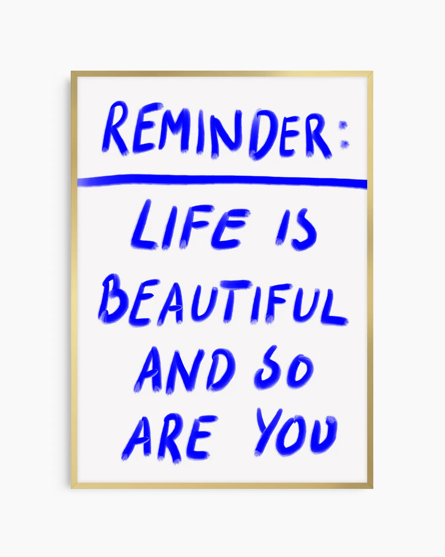 Framed poster with motivational quote 'Reminder: Life is beautiful and so are you' in blue text on a white background