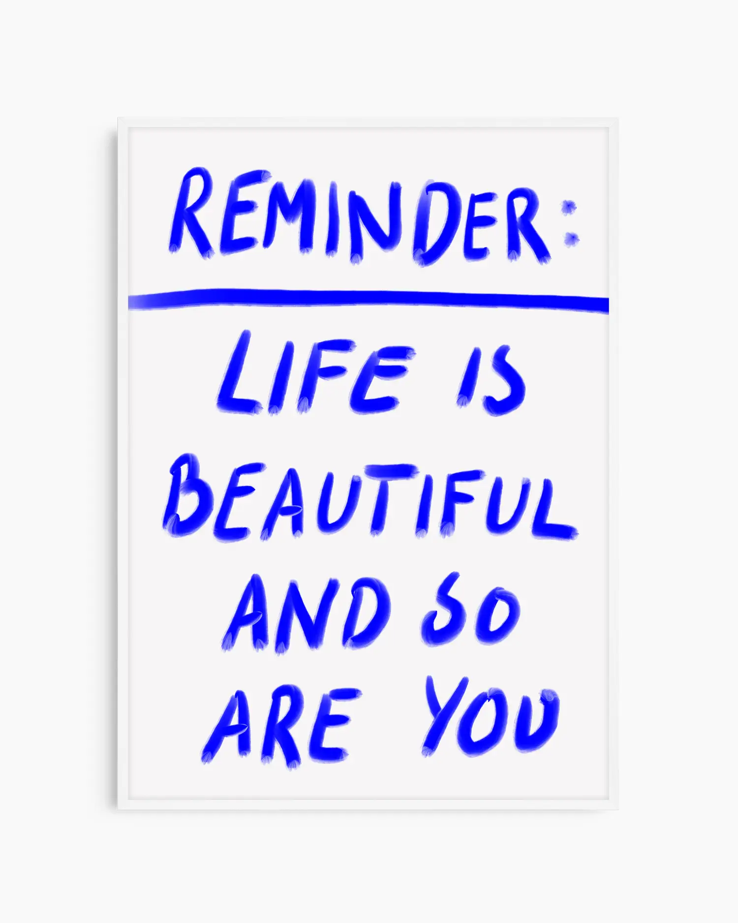 Framed poster with motivational quote 'Reminder: Life is beautiful and so are you' in blue text on a white background