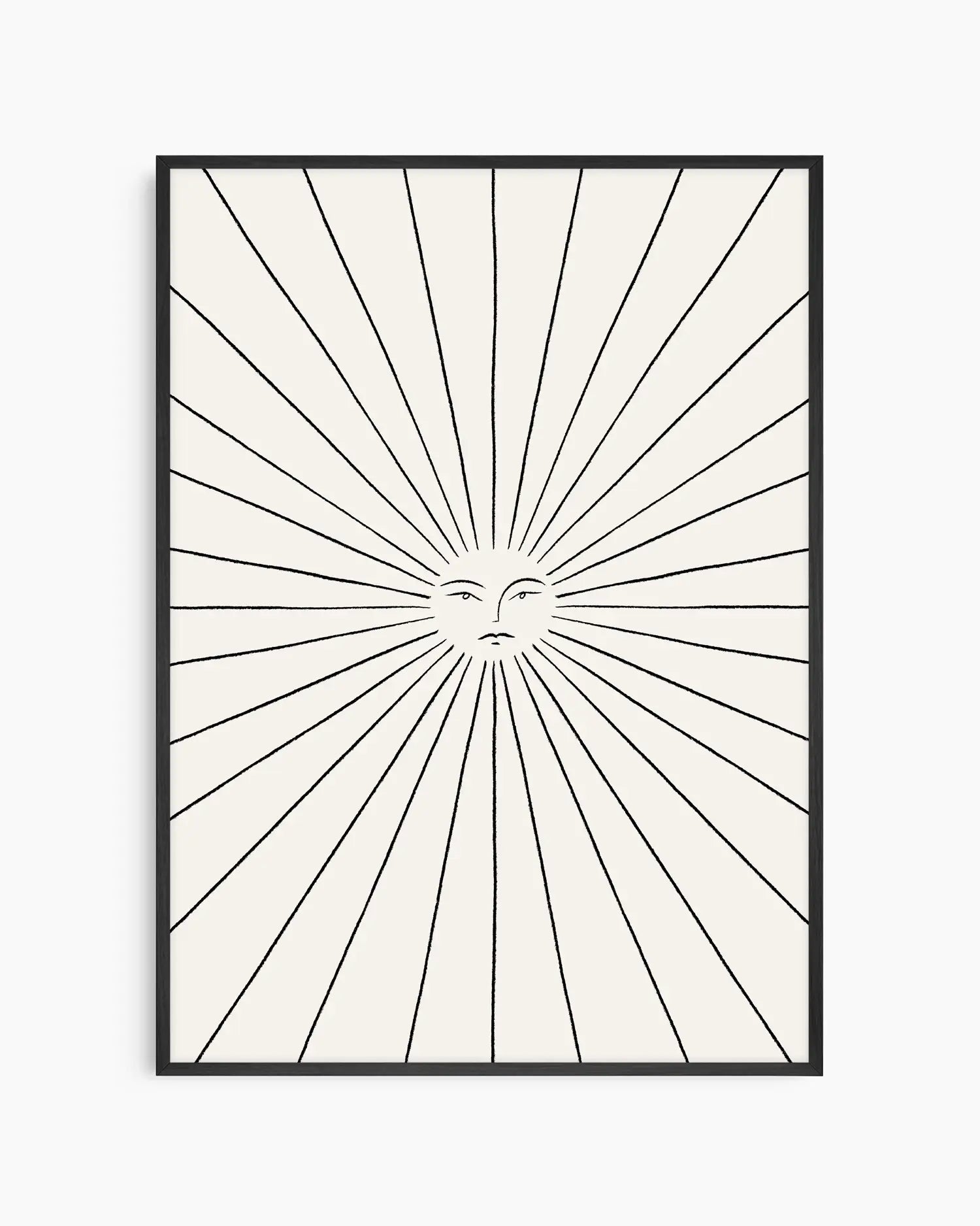 Framed artwork with a sunburst design and face in the center on a white background
