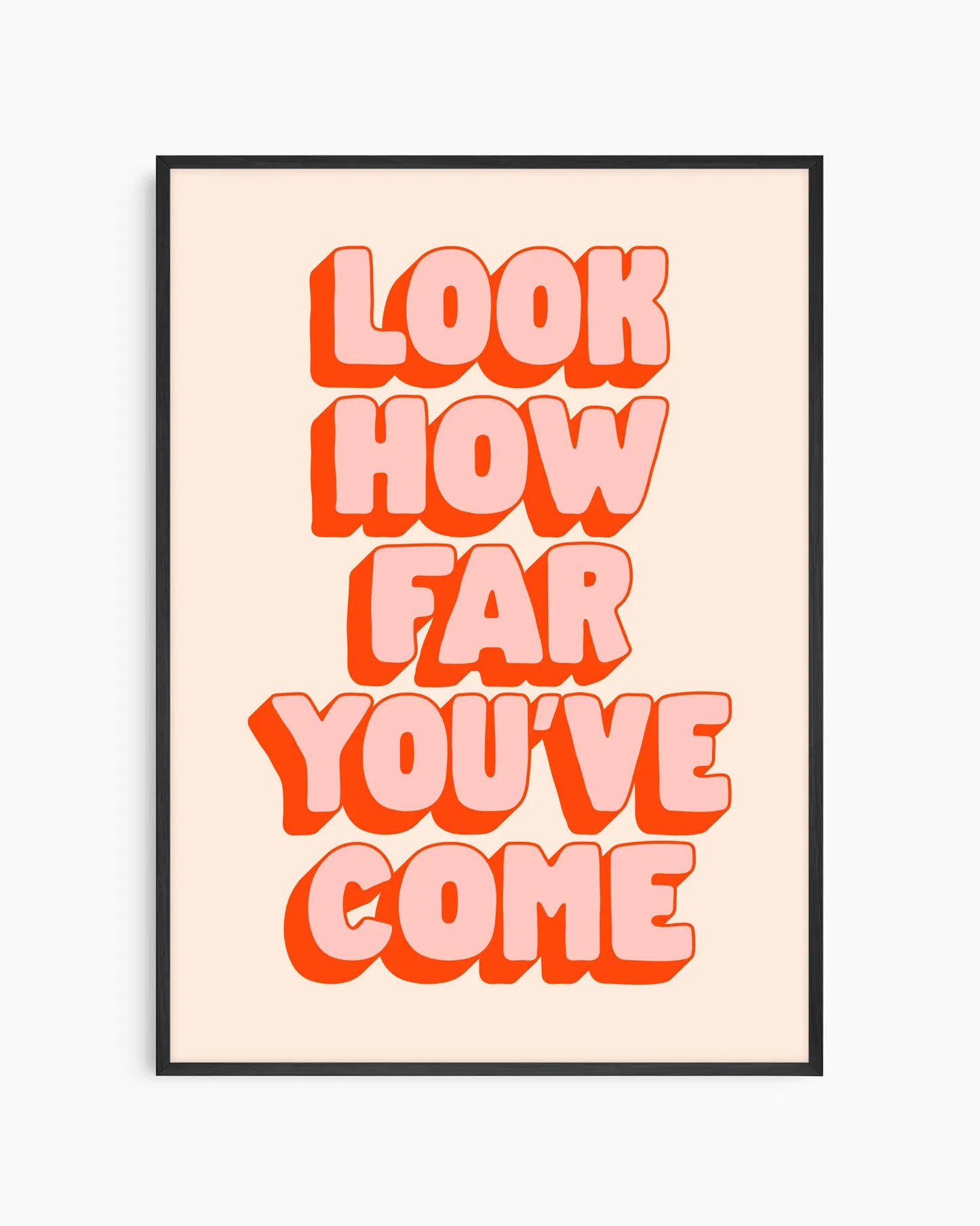 Framed poster with motivational quote 'Look how far you've come' in bold red letters on a beige background
