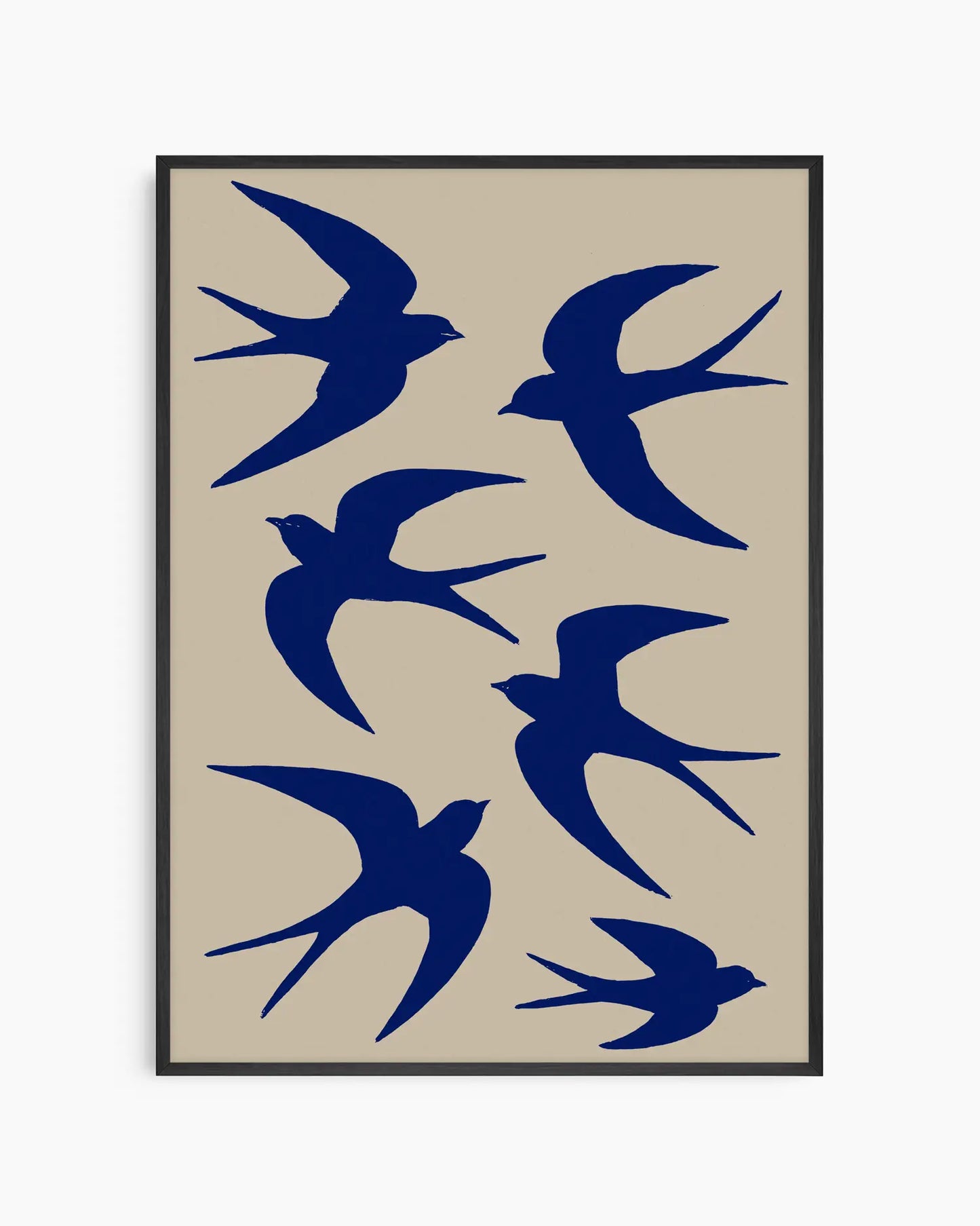 Framed artwork with blue bird silhouettes on a beige background