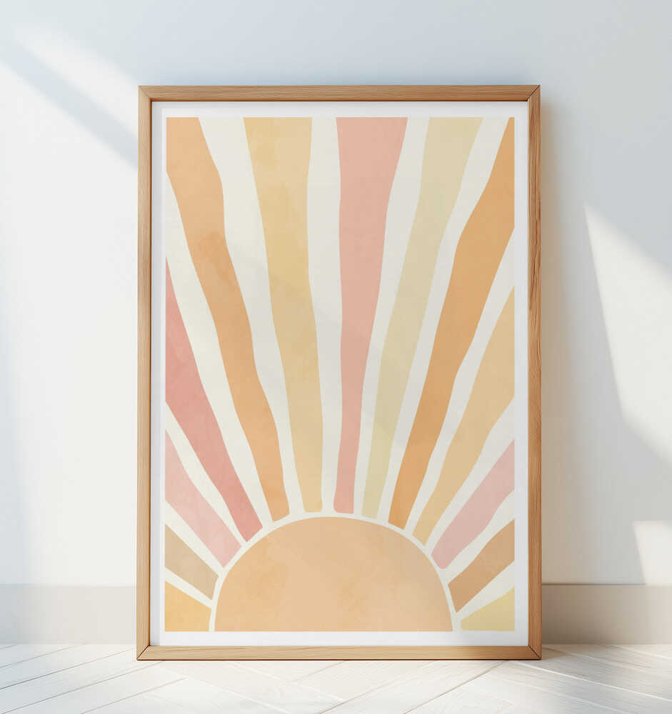 Abstract sunrise poster in calming beige, peach, and blush tones, framed in light wood and leaning against a white wall. A soft and modern art print that brightens any space with a peaceful, positive vibe.